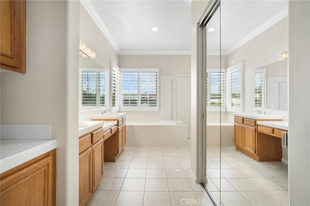 bathroom featuring ornamental molding, a healthy amount of sunlight, and tile patterned floors