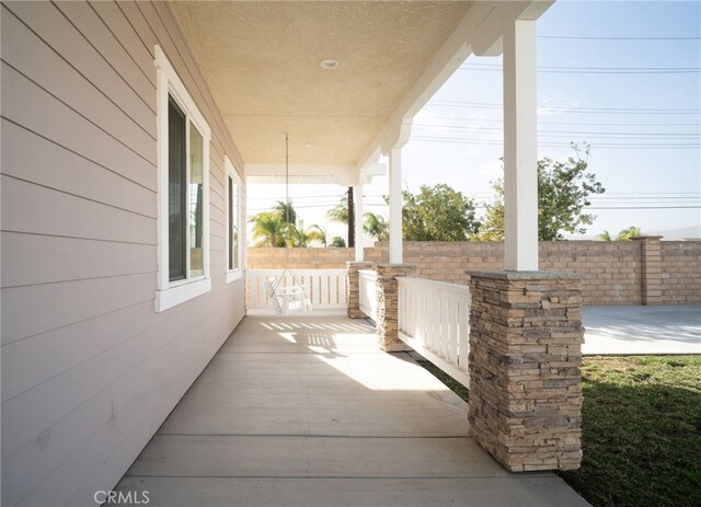 view of patio featuring a porch