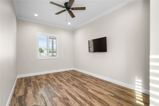 unfurnished room featuring ceiling fan, ornamental molding, and hardwood / wood-style flooring