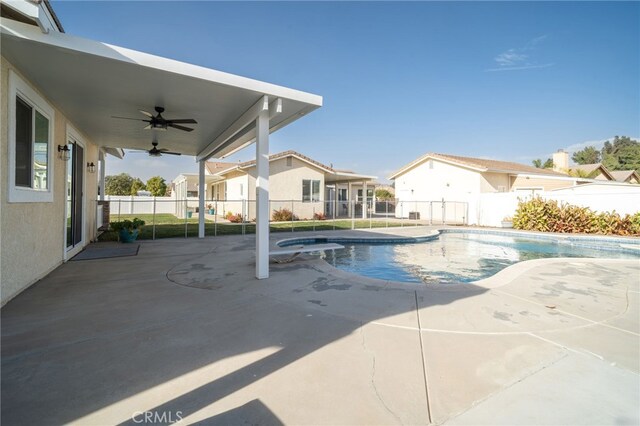 view of pool featuring ceiling fan, an in ground hot tub, and a patio