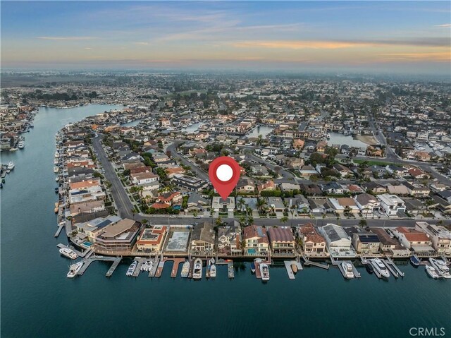 aerial view at dusk with a water view