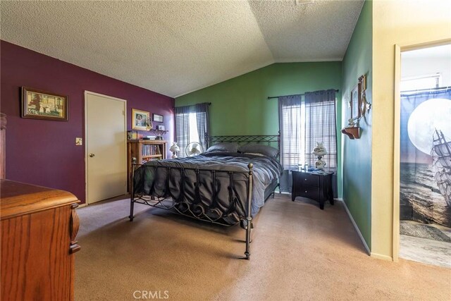 carpeted bedroom featuring vaulted ceiling, a textured ceiling, and multiple windows