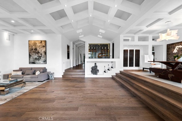 living room featuring dark hardwood / wood-style floors and beam ceiling