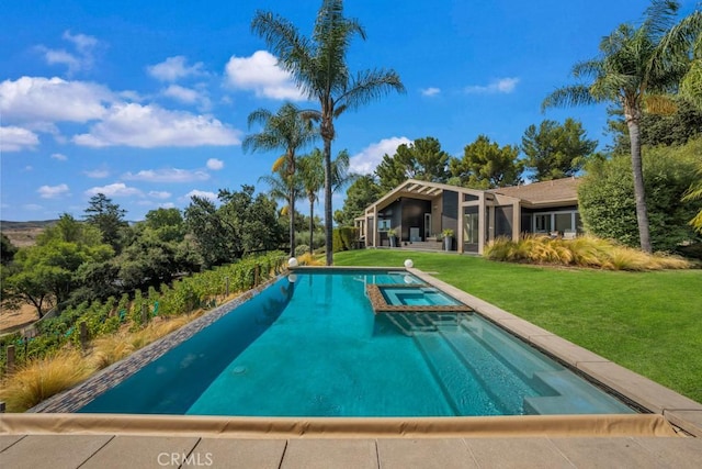 view of pool with an in ground hot tub and a yard