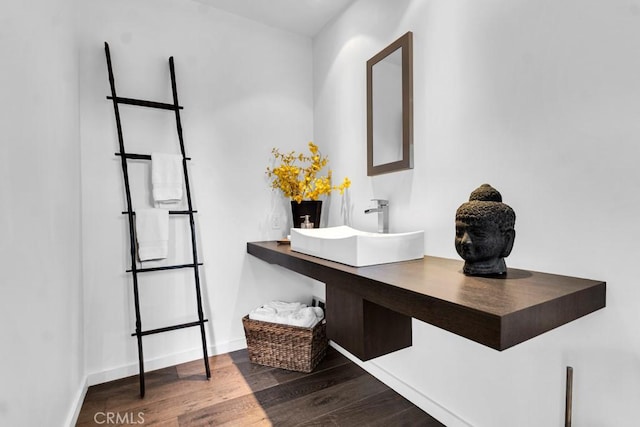 bathroom with wood-type flooring and sink