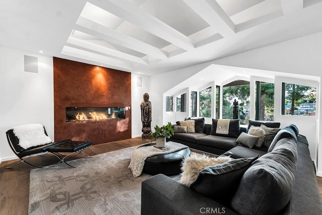 living room featuring a large fireplace and hardwood / wood-style floors