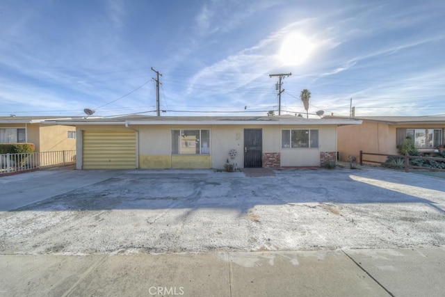 single story home with a garage