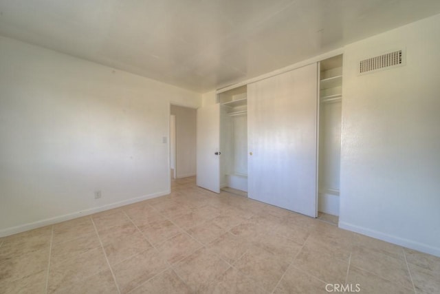 unfurnished bedroom featuring a closet