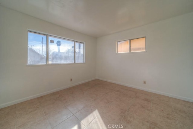 spare room with light tile patterned flooring