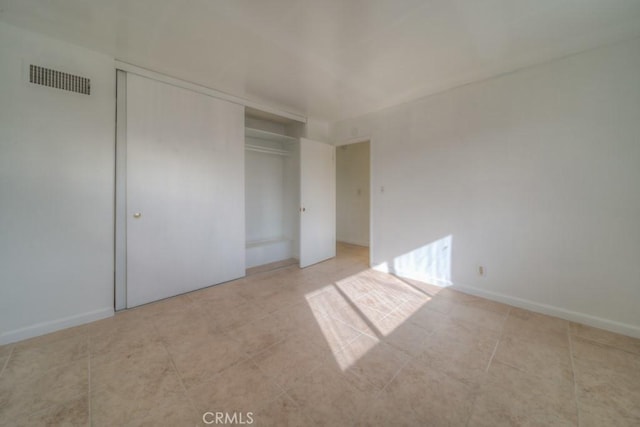 unfurnished bedroom featuring a closet