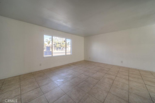 empty room featuring light tile patterned floors