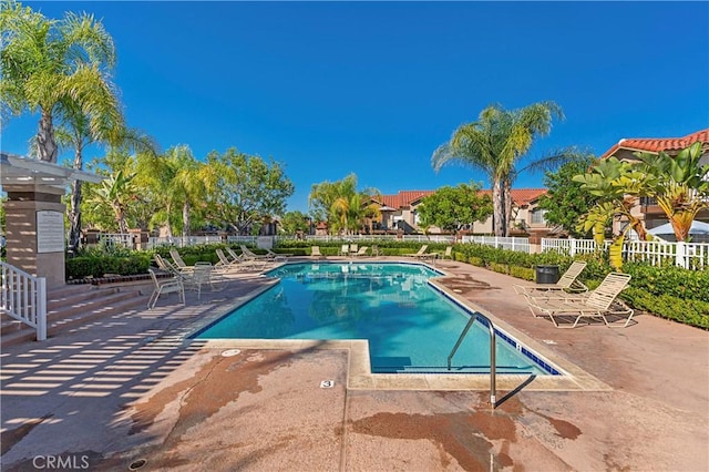 view of swimming pool with a patio