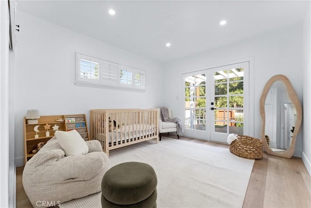 interior space featuring hardwood / wood-style flooring, access to exterior, and french doors