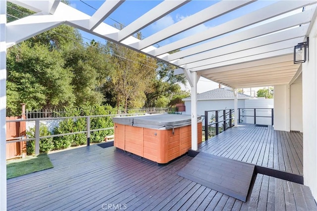 wooden terrace with a hot tub and a pergola