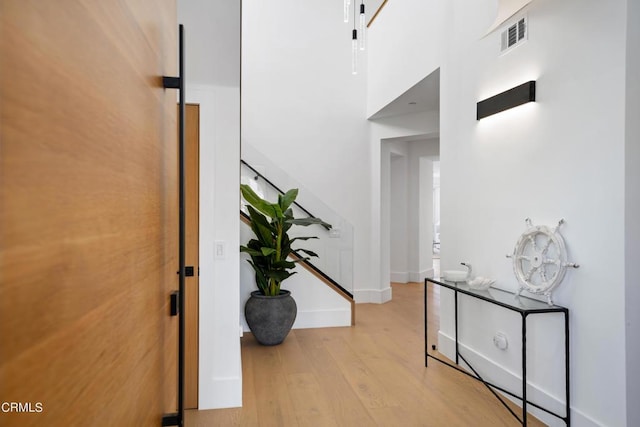 corridor featuring light hardwood / wood-style floors