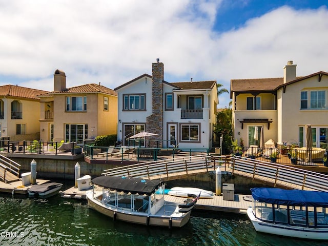 rear view of house with a water view