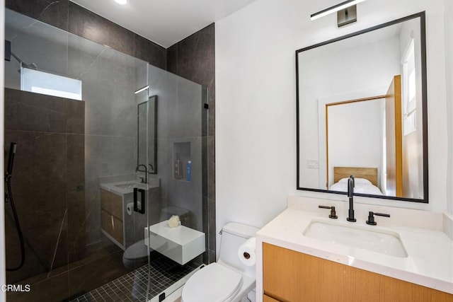 bathroom featuring walk in shower, vanity, and toilet