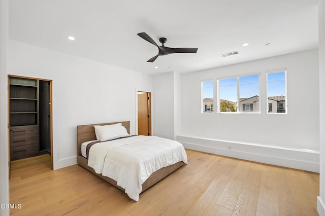 bedroom featuring ceiling fan and light hardwood / wood-style flooring