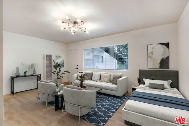 bedroom featuring a notable chandelier and hardwood / wood-style floors