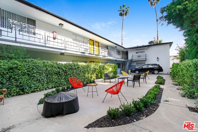 surrounding community featuring a patio area