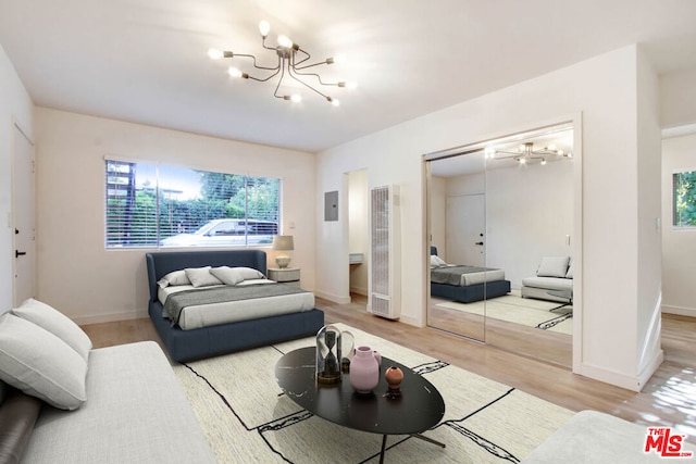 living room with a chandelier and hardwood / wood-style flooring