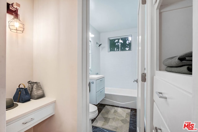 full bathroom with toilet, vanity, tile patterned floors, and tiled shower / bath