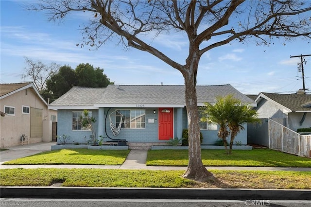 ranch-style house with a front lawn