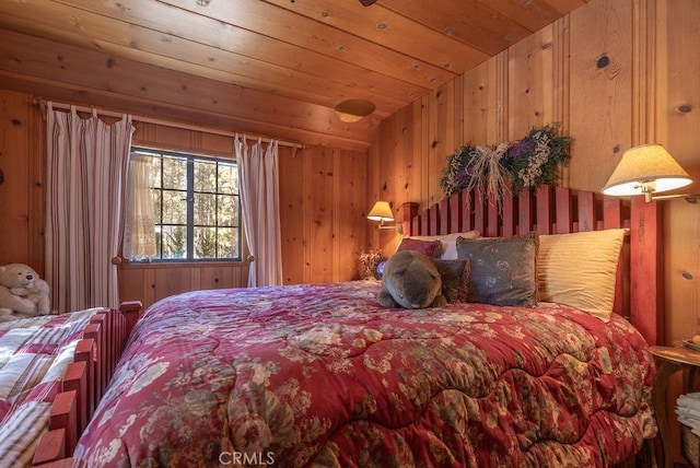 bedroom with lofted ceiling, wood ceiling, and wood walls