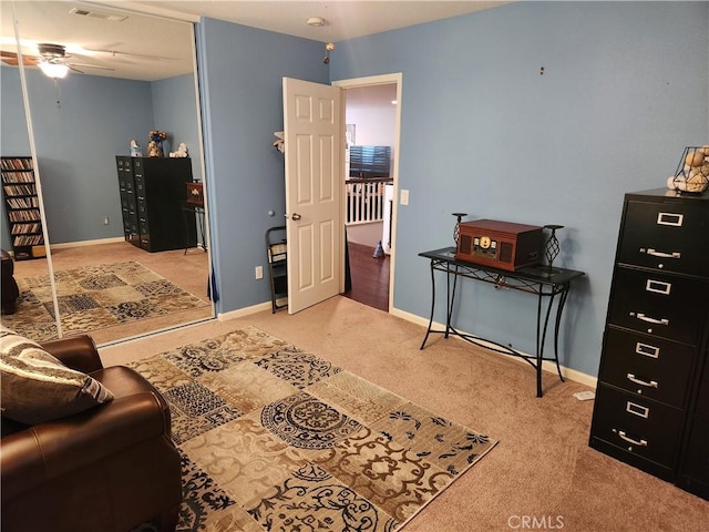 bedroom with ceiling fan and light colored carpet