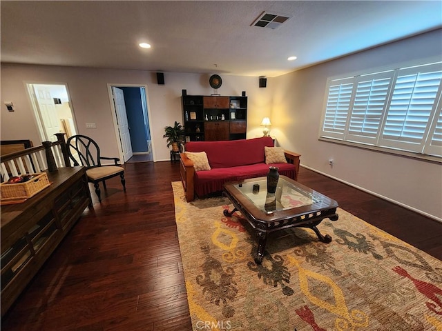 living room with dark hardwood / wood-style flooring