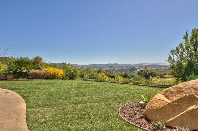 view of yard with a mountain view