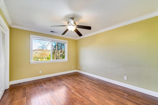 interior space featuring ceiling fan, ornamental molding, and hardwood / wood-style floors