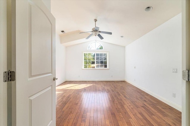 spare room featuring ceiling fan, hardwood / wood-style floors, and vaulted ceiling