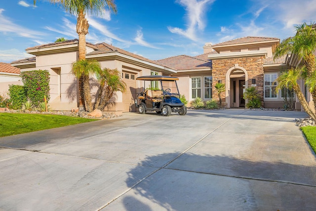 mediterranean / spanish house with a garage