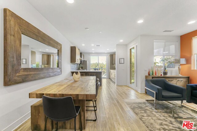 dining room with light hardwood / wood-style flooring