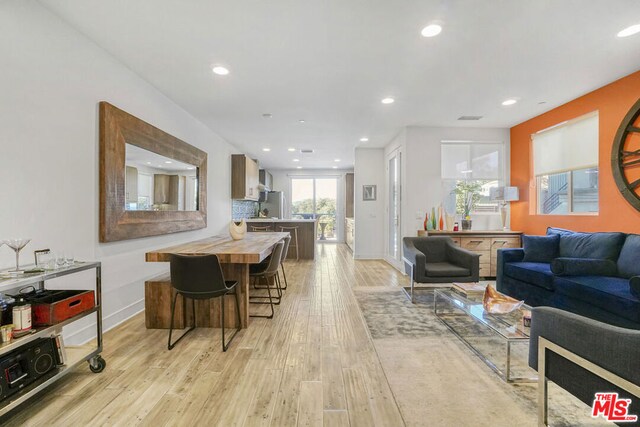 living room with light hardwood / wood-style floors