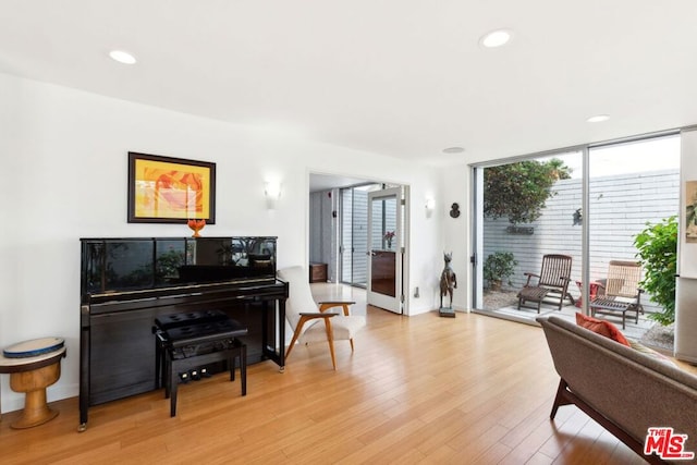 interior space with expansive windows and light wood-type flooring