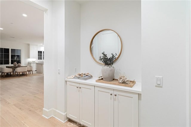 corridor featuring light hardwood / wood-style floors