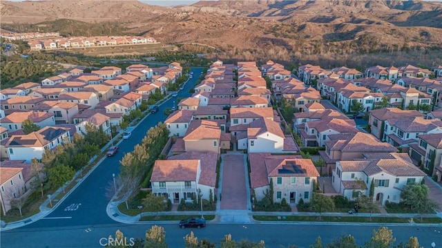 birds eye view of property featuring a mountain view