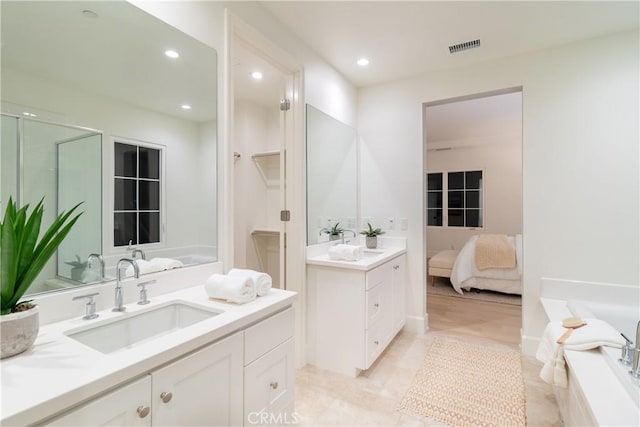 bathroom with independent shower and bath and vanity