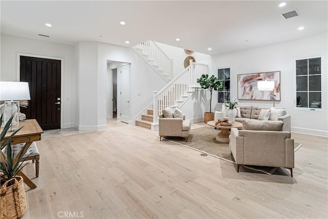 living room with light hardwood / wood-style flooring