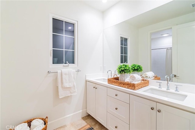 bathroom featuring a shower with curtain and vanity