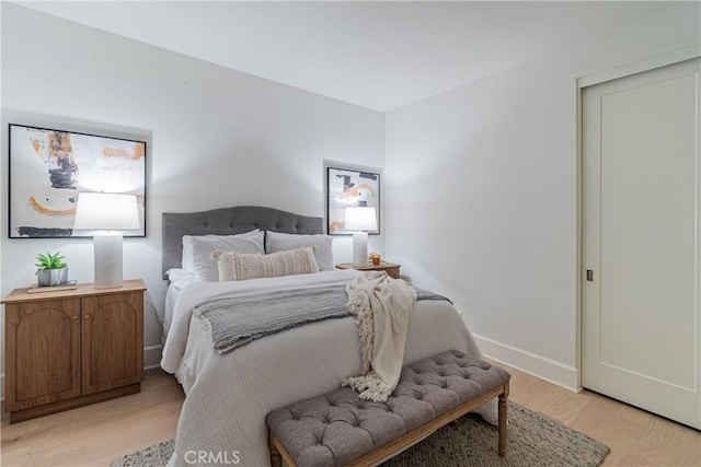 bedroom with light hardwood / wood-style floors