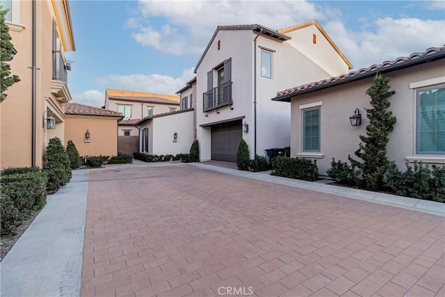 view of side of property with a garage