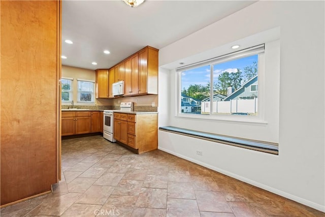 kitchen featuring sink and white appliances