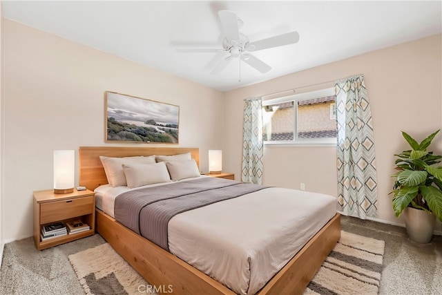 bedroom featuring ceiling fan and light colored carpet