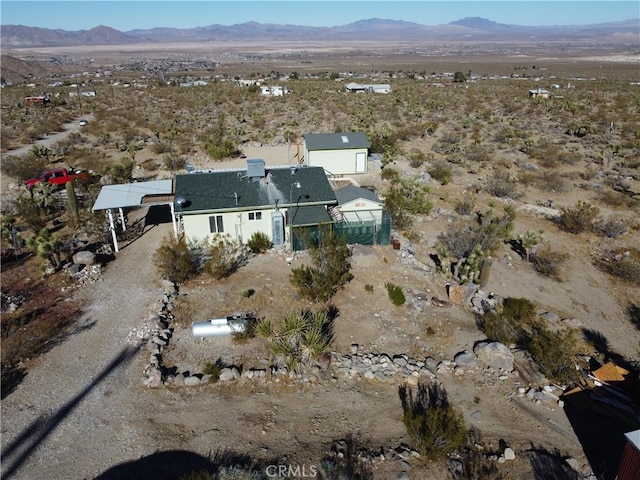 drone / aerial view featuring a mountain view