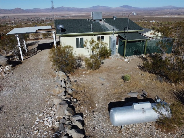 back of house featuring a mountain view