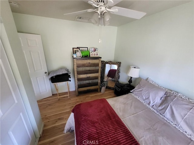 bedroom featuring hardwood / wood-style floors and ceiling fan