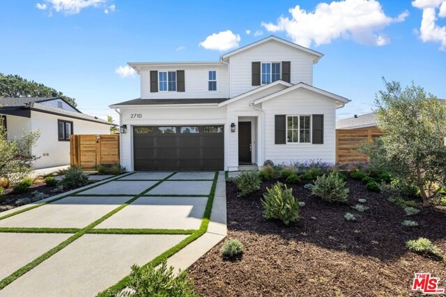 modern inspired farmhouse featuring a garage